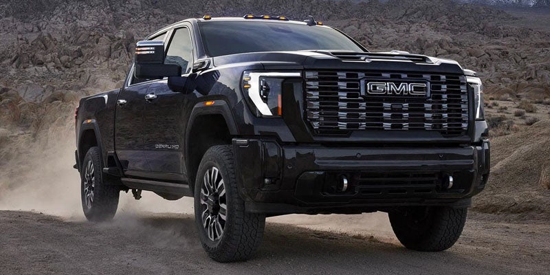 Close-up view of the rugged tire on a 2026 GMC Sierra 3500HD, showcasing robust tread design engineered for traction, stability